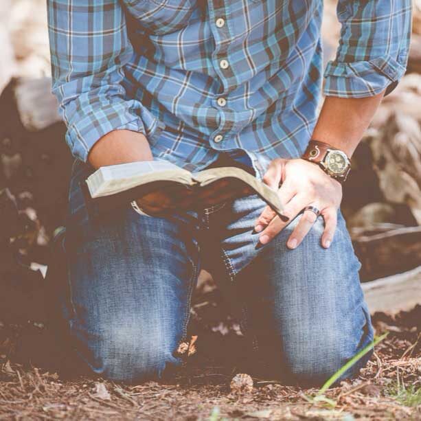 man reading the Bible in Men's Ministries